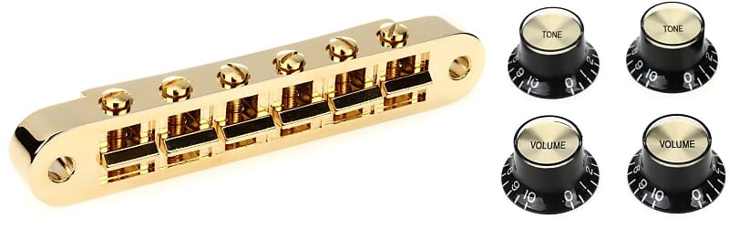 Аксессуары Gibson Бридж Nashville Tune-O-Matic с полной сборкой - Золотой комплект с аксессуарами Gibson Ручки Top Hat со вставками, 4 шт. - Черный с золотой металлической вставкой Gibson Accessories PBBR-040=1 PRMK-020=1
Аксессуары Gibson Бридж Nashville Tune-O-Matic с полной сборкой - Золотой комплект с аксессуарами Gibson Ручки Top Hat со вставками, 4 шт. - Черный с золотой металлической вставкой Gibson Accessories PBBR-040=1 PRMK-020=1