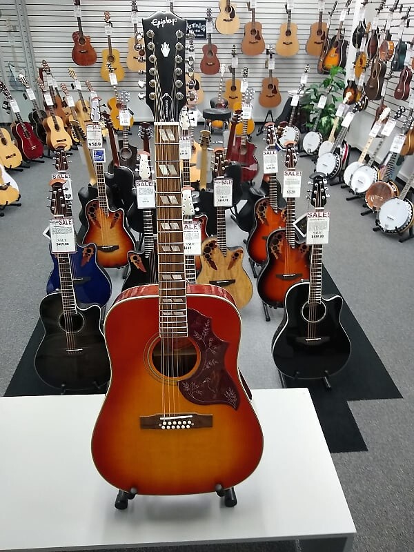 Epiphone вдохновлен Gibson 12 String Hummingbird Aged Cherry Sunburst Gloss Inspired By Gibson 12 String Hummingbird Aged Cherry Sunburst Gloss
Epiphone вдохновлен Gibson 12 String Hummingbird Aged Cherry Sunburst Gloss Inspired By Gibson 12 String Hummingbird Aged Cherry Sunburst Gloss