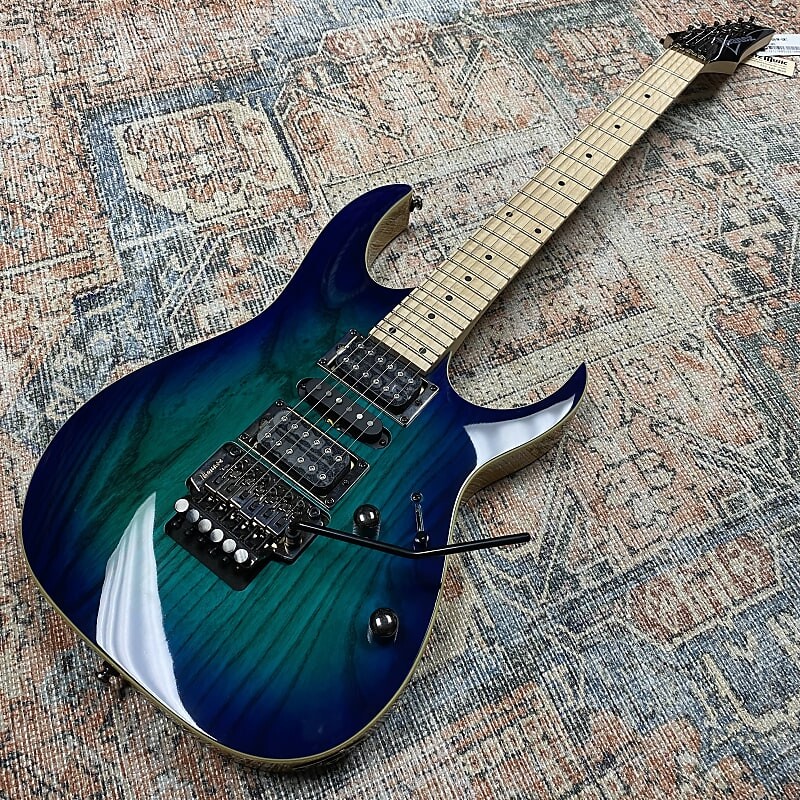 Электрогитара Ibanez RG470AHM-BMT Standard 2017 - Present - Blue Moon Burst w/BONUS Ibanez Hardshell Case
Электрогитара Ibanez RG470AHM-BMT Standard 2017 - Present - Blue Moon Burst w/BONUS Ibanez Hardshell Case