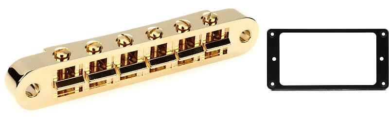 Аксессуары Gibson Бридж Nashville Tune-O-Matic с полной сборкой - золотой комплект с креплением на грифе для звукоснимателя Gibson Accessories - черный PBBR-040=1 PRPR-010=1
Аксессуары Gibson Бридж Nashville Tune-O-Matic с полной сборкой - золотой комплект с креплением на грифе для звукоснимателя Gibson Accessories - черный PBBR-040=1 PRPR-010=1