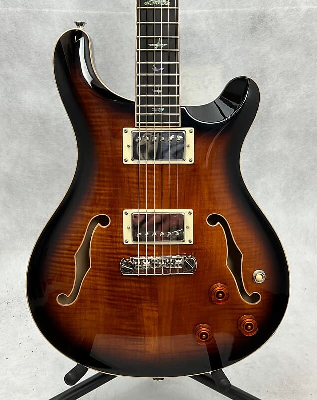 PRS SE Hollowbody II Piezo Electric Guitar - Black Gold Burst с футляром
PRS SE Hollowbody II Piezo Electric Guitar - Black Gold Burst с футляром