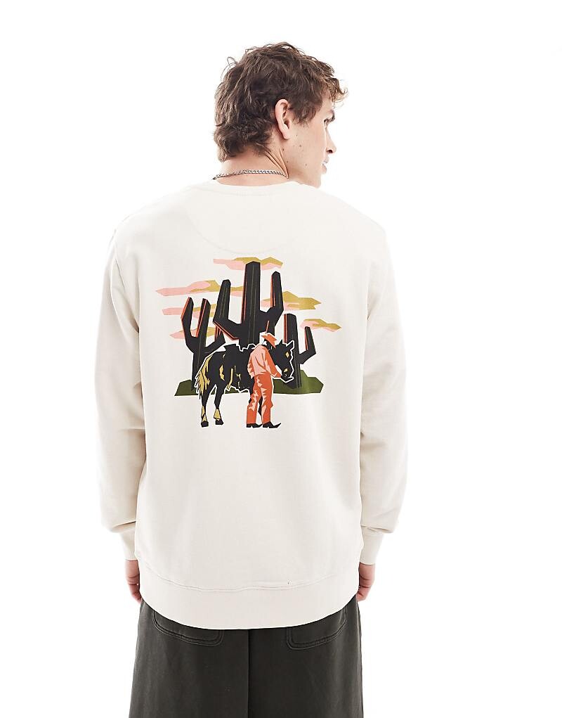Wrangler – толстовка свободного кроя кремового цвета с ковбойским принтом на спине
Wrangler – толстовка свободного кроя кремового цвета с ковбойским принтом на спине