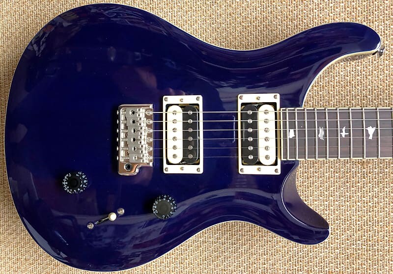 Электрогитара PRS SE Standard 24 Solidbody Trans Blue Mahogany с кленовым грифом, вибрато, сумка
Электрогитара PRS SE Standard 24 Solidbody Trans Blue Mahogany с кленовым грифом, вибрато, сумка