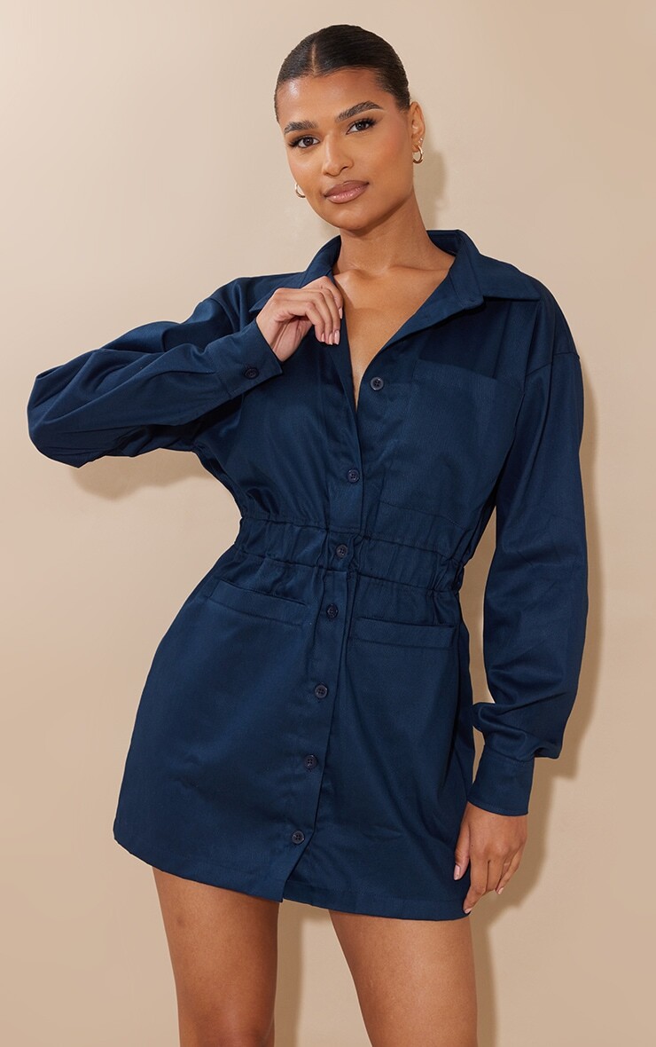 PrettyLittleThing Темно-синее платье-рубашка с карманами и эластичной резинкой на талии из твила
PrettyLittleThing Темно-синее платье-рубашка с карманами и эластичной резинкой на талии из твила