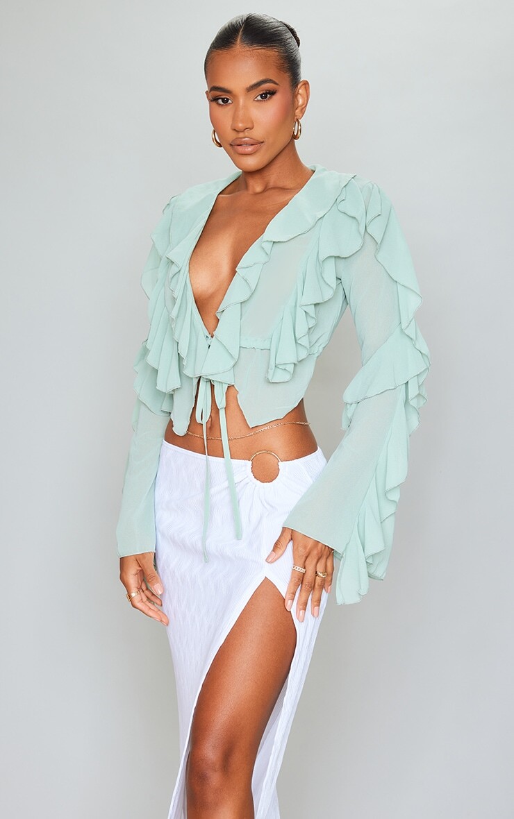 PrettyLittleThing Зеленая блузка с расклешенными рукавами и завязкой спереди с оборками Sage Green
PrettyLittleThing Зеленая блузка с расклешенными рукавами и завязкой спереди с оборками Sage Green