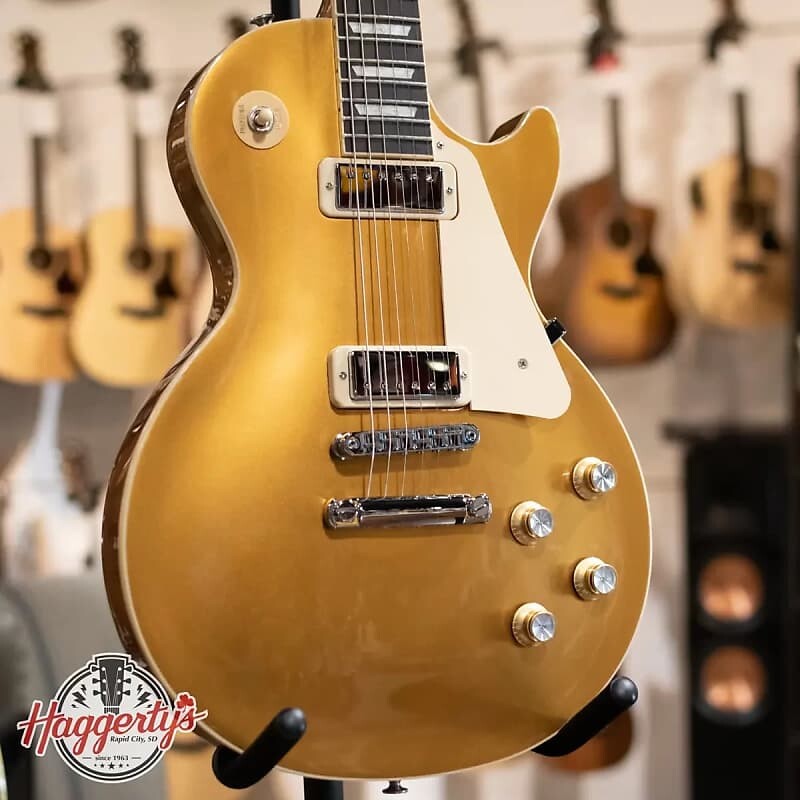 Электрогитара Gibson Les Paul 70's Deluxe Electric Guitar - Gold Top with Hard Shell Case
Электрогитара Gibson Les Paul 70's Deluxe Electric Guitar - Gold Top with Hard Shell Case