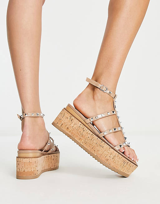 Светло-коричневые босоножки на плоской платформе Steve Madden Clovis с заклепками
Светло-коричневые босоножки на плоской платформе Steve Madden Clovis с заклепками