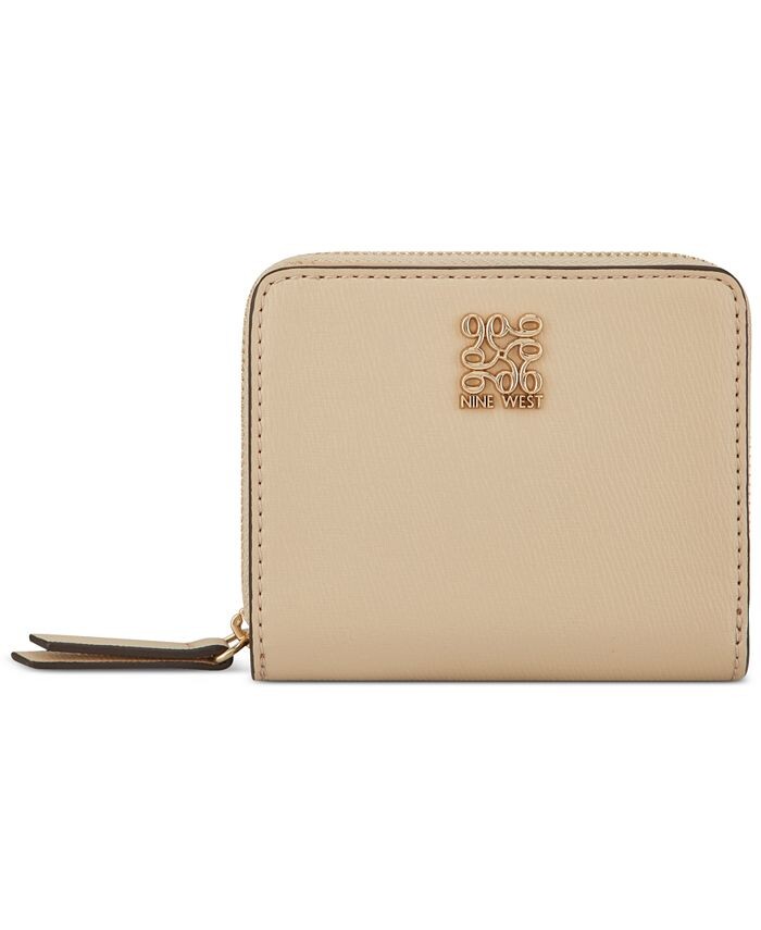 Маленький кожаный кошелек Grid 9 с хорошей мини-молнией вокруг Nine West, цвет Beige
Маленький кожаный кошелек Grid 9 с хорошей мини-молнией вокруг Nine West, цвет Beige