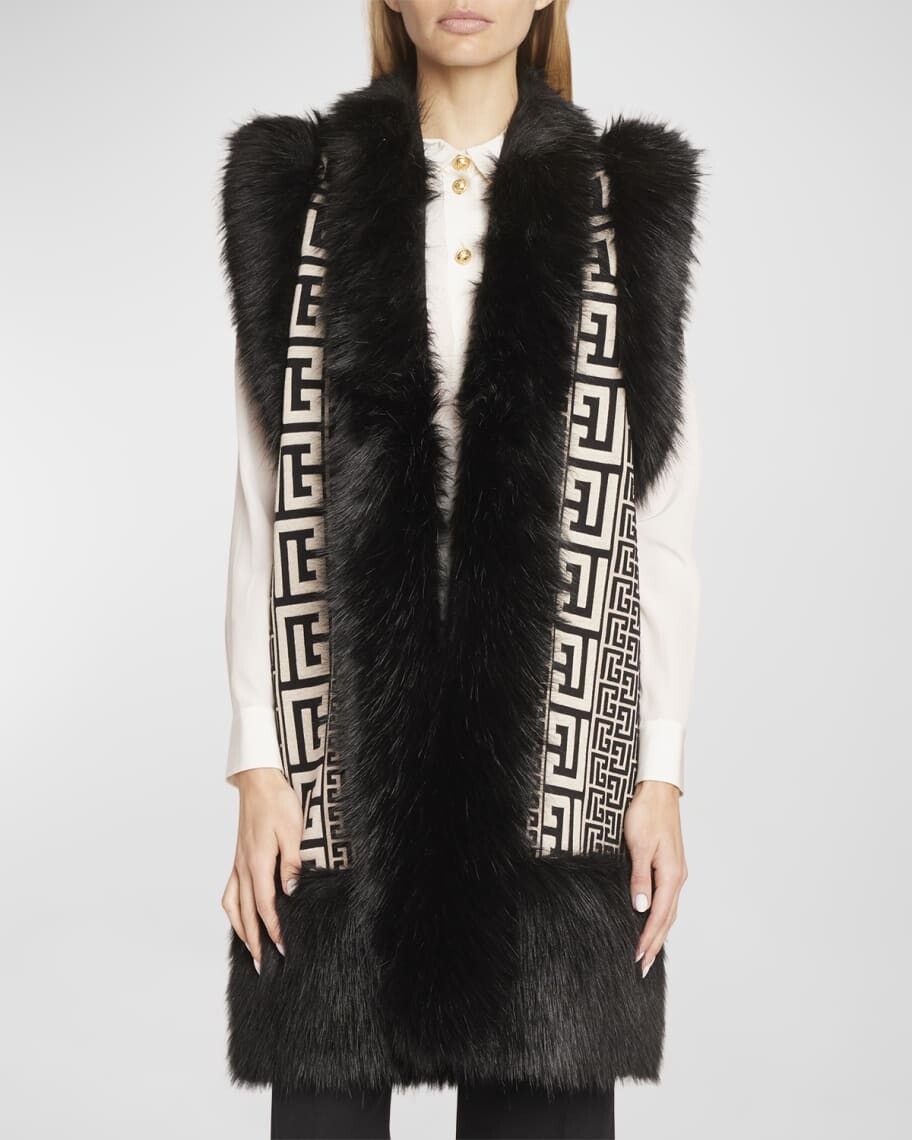 Вязаный длинный кардиган с монограммой и отделкой из искусственного меха Balmain
Вязаный длинный кардиган с монограммой и отделкой из искусственного меха Balmain