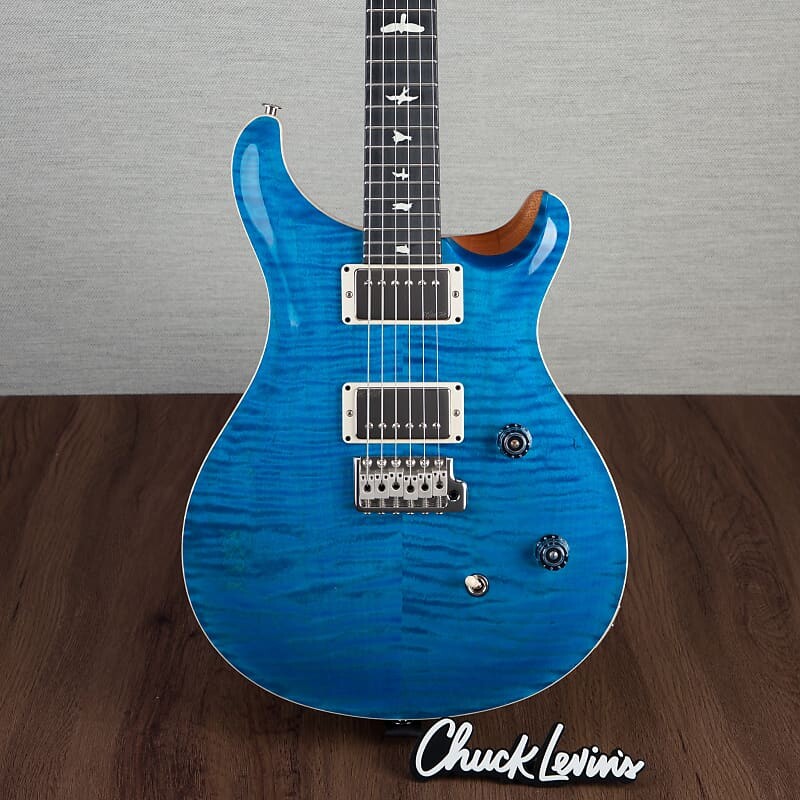 Электрогитара PRS CE24 Flame Maple Electric Guitar, Ebony Fingerboard - Blue Mateo - CHUCKSCLUSIVE - #230364924
Электрогитара PRS CE24 Flame Maple Electric Guitar, Ebony Fingerboard - Blue Mateo - CHUCKSCLUSIVE - #230364924