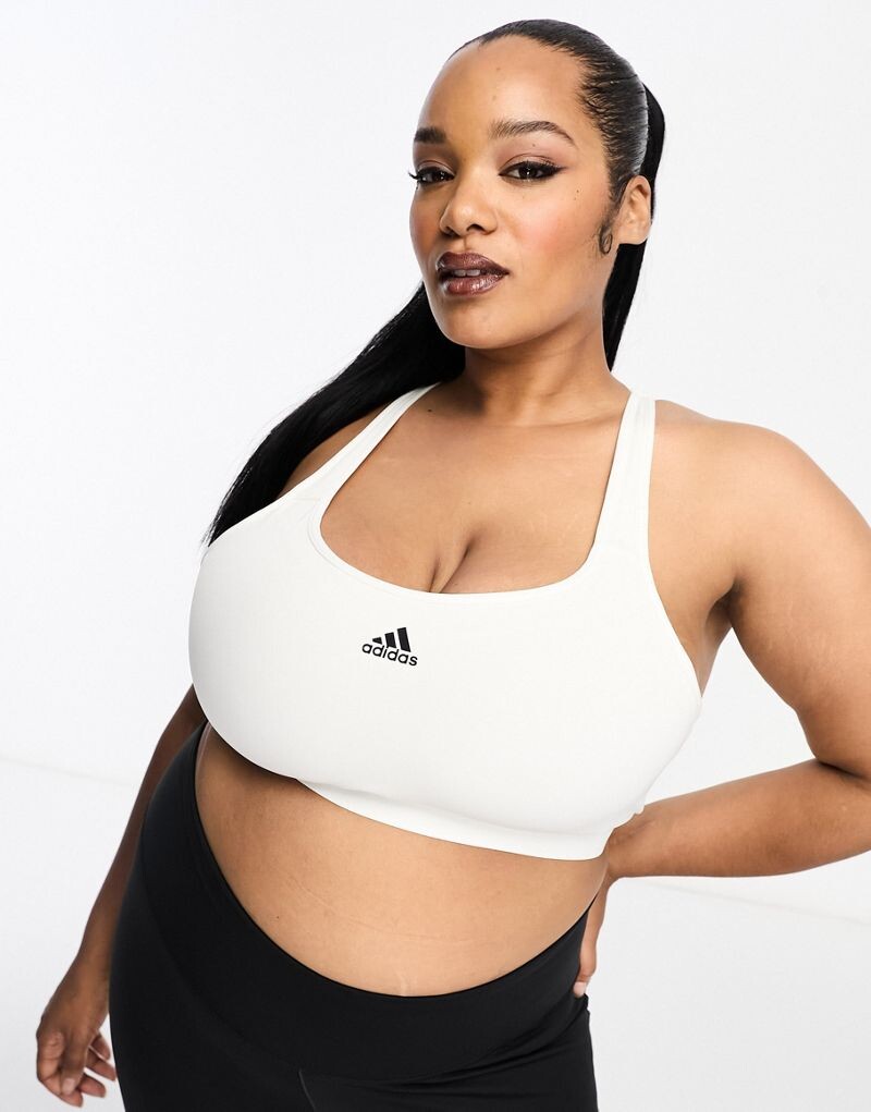 Белый спортивный бюстгальтер с высокой поддержкой и логотипом на груди adidas Training Plus adidas
Белый спортивный бюстгальтер с высокой поддержкой и логотипом на груди adidas Training Plus adidas