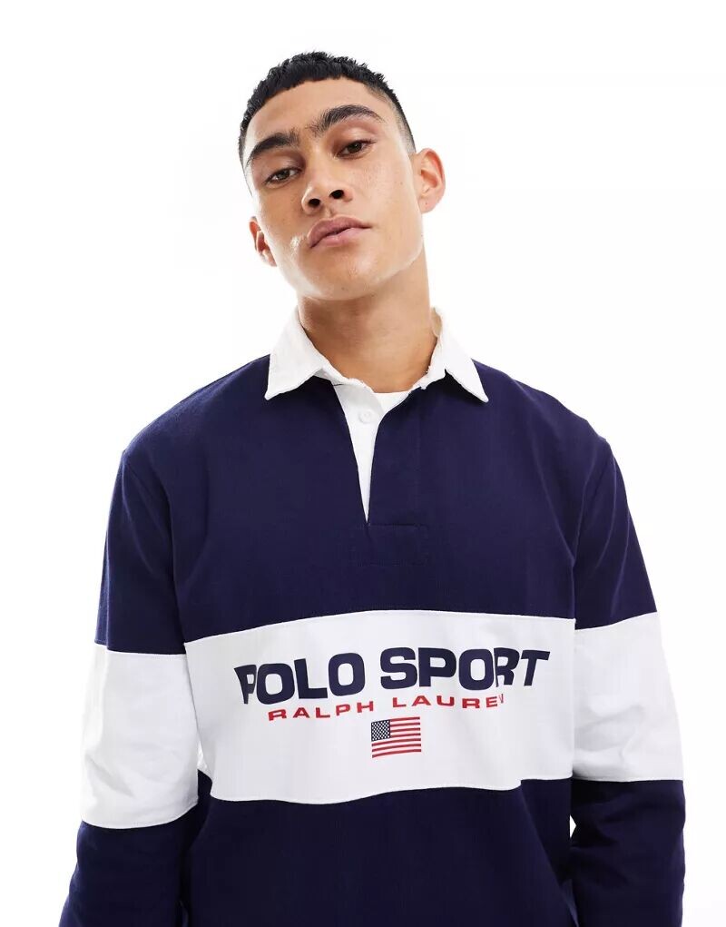 Темно-синяя рубашка-поло для регби с полоской-логотипом на груди Polo Ralph Lauren Sport Capsule
Темно-синяя рубашка-поло для регби с полоской-логотипом на груди Polo Ralph Lauren Sport Capsule
