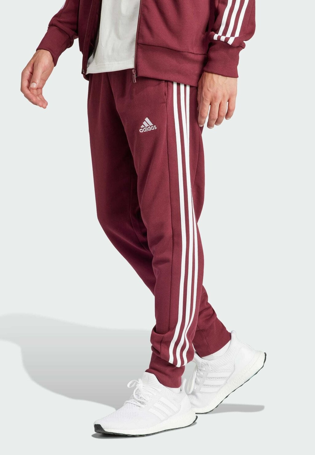 Спортивные брюки Essentials Tapered Cuffed 3-Stripes adidas Sportswear, цвет shadow red
Спортивные брюки Essentials Tapered Cuffed 3-Stripes adidas Sportswear, цвет shadow red