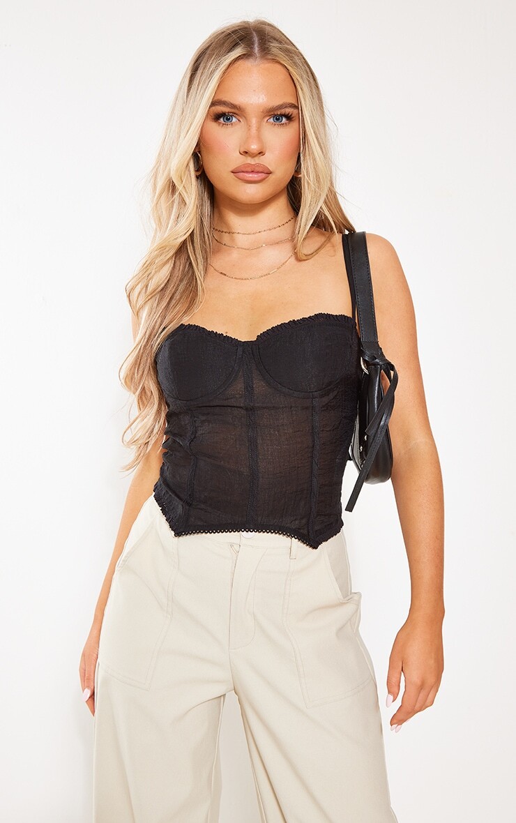 PrettyLittleThing Черный укороченный топ из фактурного шифона на косточках с чашками
PrettyLittleThing Черный укороченный топ из фактурного шифона на косточках с чашками