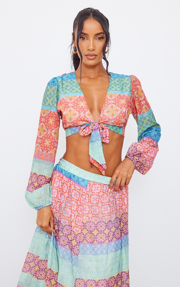 PrettyLittleThing Шифоновая блузка с разноцветным принтом и завязками спереди с объемными рукавами
PrettyLittleThing Шифоновая блузка с разноцветным принтом и завязками спереди с объемными рукавами
