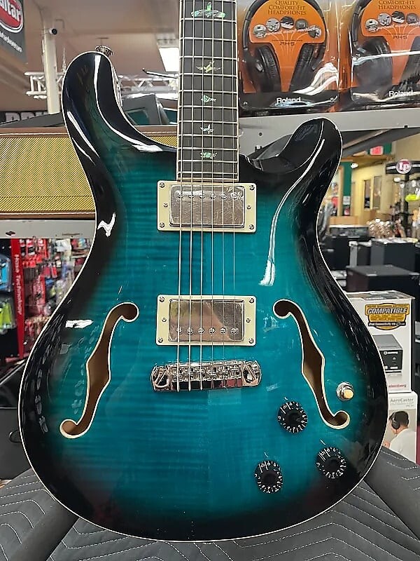 Пьезоэлектрическая гитара PRS SE Hollowbody II, цвет «синий павлин» SE Hollowbody II Piezo Electric Guitar - Peacock Blue
Пьезоэлектрическая гитара PRS SE Hollowbody II, цвет «синий павлин» SE Hollowbody II Piezo Electric Guitar - Peacock Blue