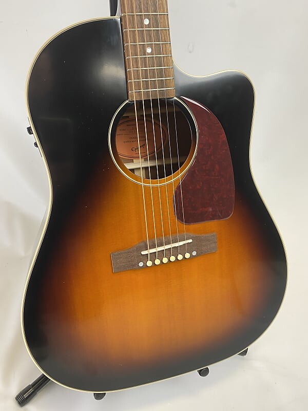 Epiphone вдохновлен электро-акустической гитарой Gibson J-45 EC, выдержанной в винтажном стиле Sunburst... Демо в открытой коробке Inspired by Gibson J-45 EC -Electric Guitar Aged
Epiphone вдохновлен электро-акустической гитарой Gibson J-45 EC, выдержанной в винтажном стиле Sunburst... Демо в открытой коробке Inspired by Gibson J-45 EC -Electric Guitar Aged