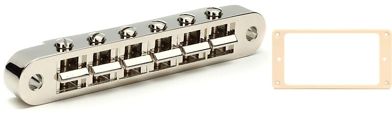 Аксессуары Gibson Бридж Nashville Tune-O-Matic с полной сборкой - никелевый комплект с аксессуарами Gibson Монтажное кольцо бриджевого звукоснимателя - кремовый Gibson Accessories PBBR-045=1 PRPR-025=1
Аксессуары Gibson Бридж Nashville Tune-O-Matic с полной сборкой - никелевый комплект с аксессуарами Gibson Монтажное кольцо бриджевого звукоснимателя - кремовый Gibson Accessories PBBR-045=1 PRPR-025=1