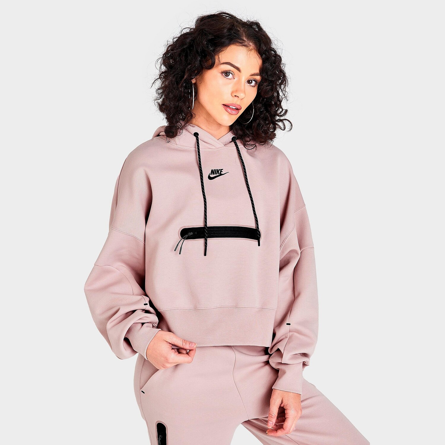 Женская укороченная толстовка с капюшоном Nike Sportswear Tech Fleece Oversize, розовый
Женская укороченная толстовка с капюшоном Nike Sportswear Tech Fleece Oversize, розовый