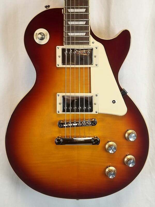 Электрогитара Epiphone Les Paul Standard 60s, чай со льдом, верхняя дека из огненного клена AA, два ProBuckers EILS6ITNH1
Электрогитара Epiphone Les Paul Standard 60s, чай со льдом, верхняя дека из огненного клена AA, два ProBuckers EILS6ITNH1
