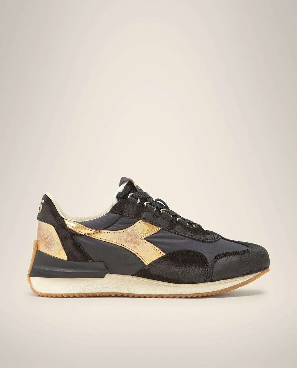 Черные женские спортивные туфли с контрастными золотыми деталями Diadora Heritage, черный
Черные женские спортивные туфли с контрастными золотыми деталями Diadora Heritage, черный