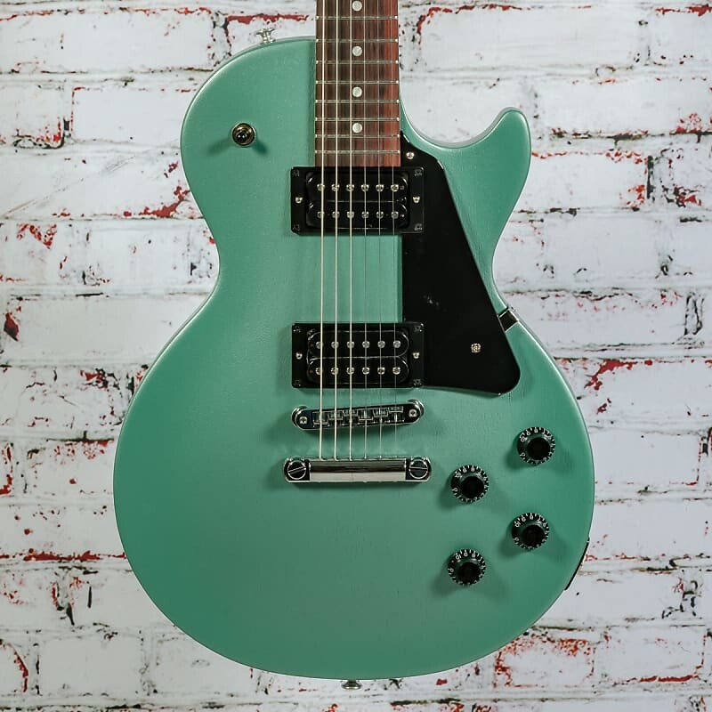 Электрогитара Gibson - Les Paul Modern Lite - Electric Guitar - Inverness Green Satin - w/ Softshell Case
Электрогитара Gibson - Les Paul Modern Lite - Electric Guitar - Inverness Green Satin - w/ Softshell Case