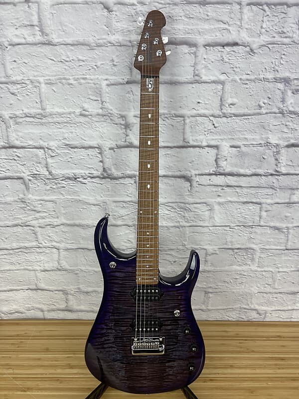 Электрогитара Ernie Ball Music Man JP15 John Petrucci Signature 2022 - Present - Purple Nebula Flame
Электрогитара Ernie Ball Music Man JP15 John Petrucci Signature 2022 - Present - Purple Nebula Flame