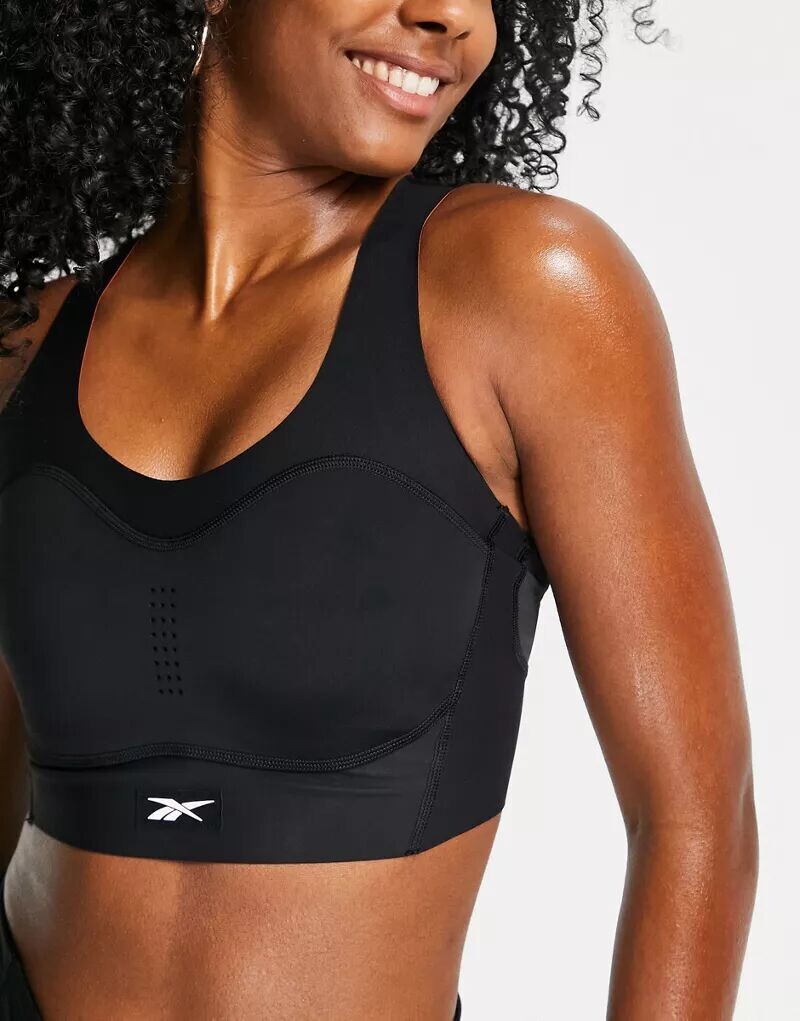 Черный спортивный бюстгальтер с высокой поддержкой Reebok Training Puremove
Черный спортивный бюстгальтер с высокой поддержкой Reebok Training Puremove