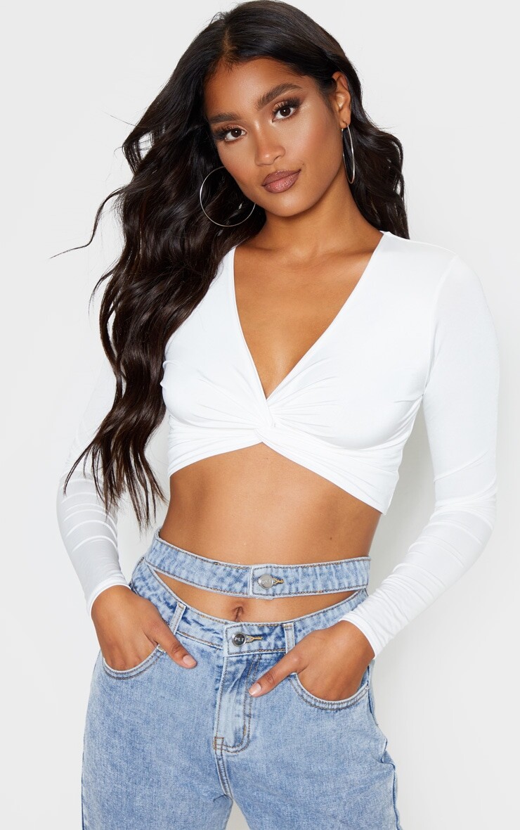 PrettyLittleThing Белый облегающий укороченный топ с длинными рукавами и закрученной передней частью
PrettyLittleThing Белый облегающий укороченный топ с длинными рукавами и закрученной передней частью