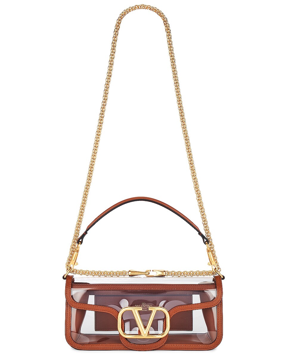 Сумка кросс-боди Valentino Garavani Loco Shoulder, цвет Transparent & Selleria
Сумка кросс-боди Valentino Garavani Loco Shoulder, цвет Transparent & Selleria