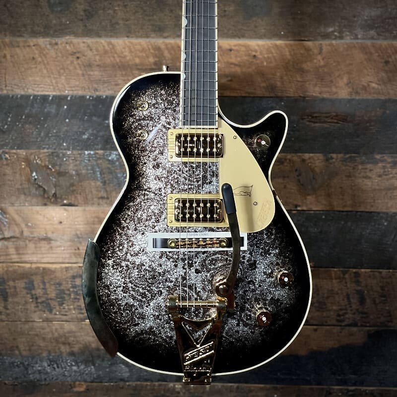 Электрогитара Gretsch G6134TG Limited-edition Paisley Penguin Electric Guitar - Blackburst over Black and Silver Paisley Sparkle #46
Электрогитара Gretsch G6134TG Limited-edition Paisley Penguin Electric Guitar - Blackburst over Black and Silver Paisley Sparkle #46