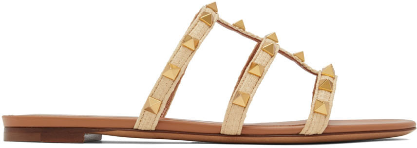 

Бежевые сандалии на плоской подошве Rockstud Valentino Garavani