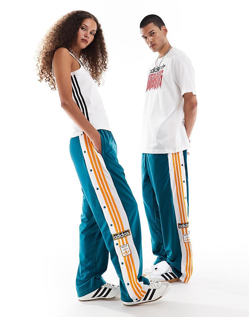 

Бирюзовые спортивные брюки adidas Originals Adibreak с оранжевыми деталями