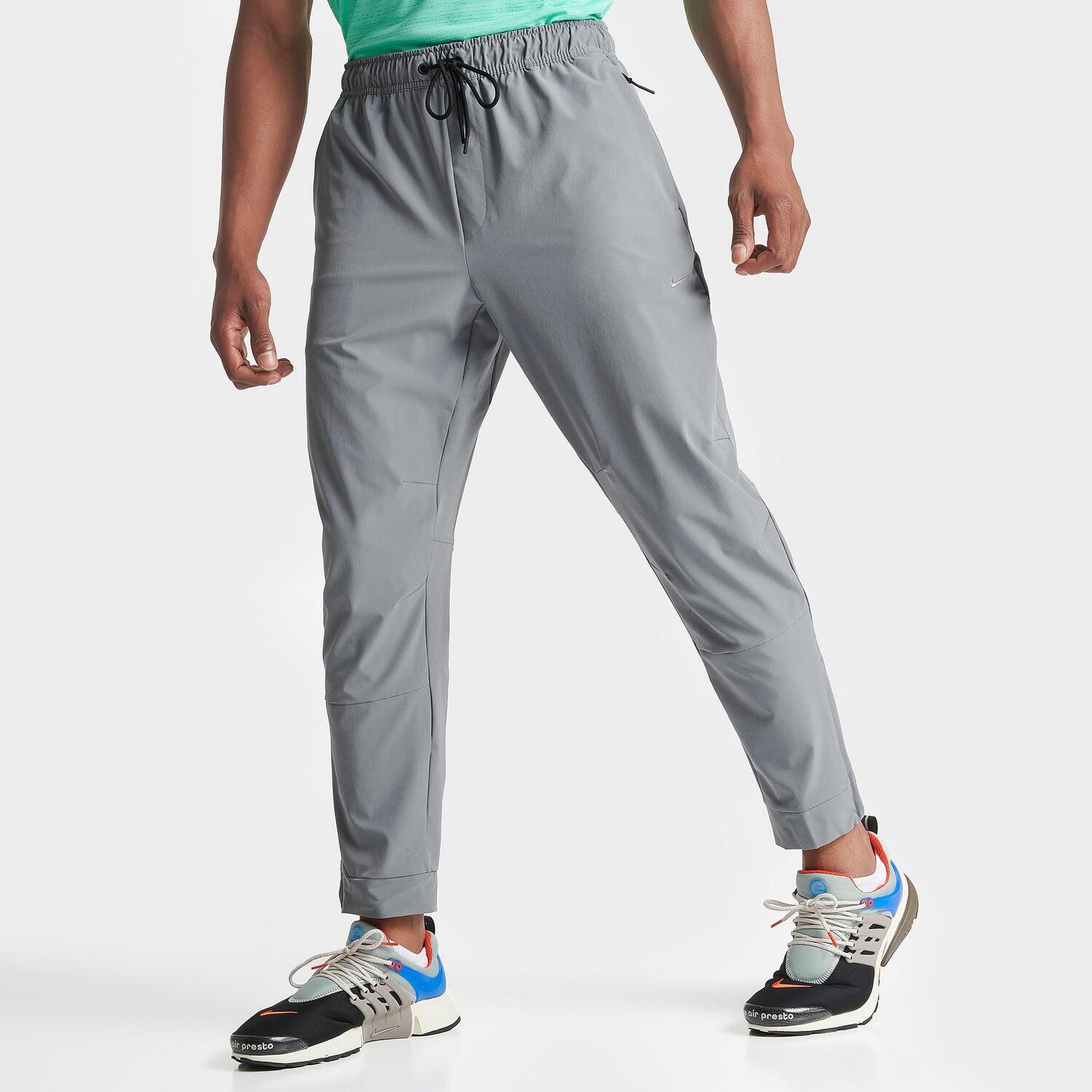 

Мужские универсальные тренировочные брюки с зауженной кромкой Nike Dri-FIT Unlimited, серый