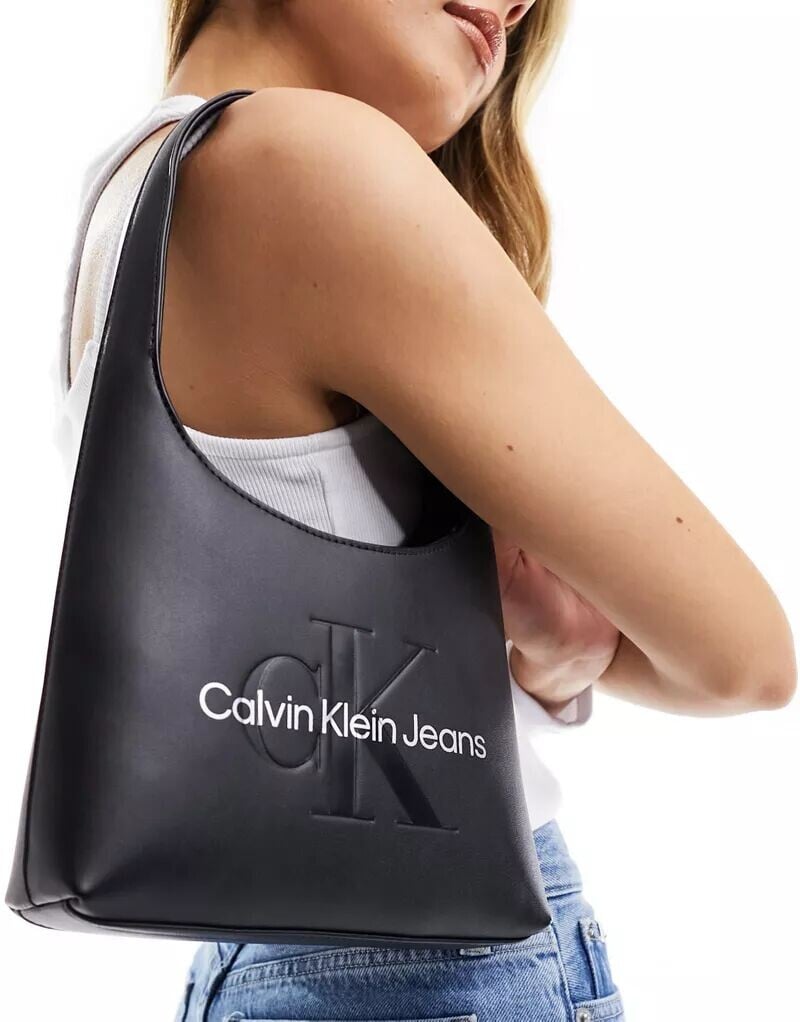 

Черная изогнутая сумка через плечо Calvin Klein