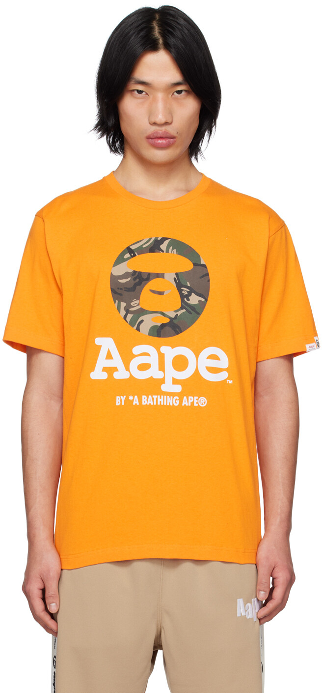 

Оранжевая футболка с камуфляжным принтом MoonFace AAPE by A Bathing Ape