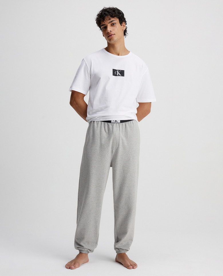 Мужские однотонные спортивные брюки Calvin Klein, серый цена и фото