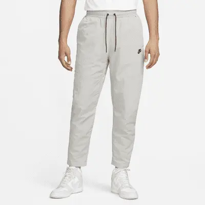 

Брюки Nike Sportswear Tech Essentials, цвет Cobblestone/Black