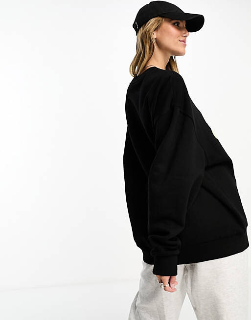 

Черный свитшот свободного кроя с оптимистичным объемным рисунком ASOS DESIGN