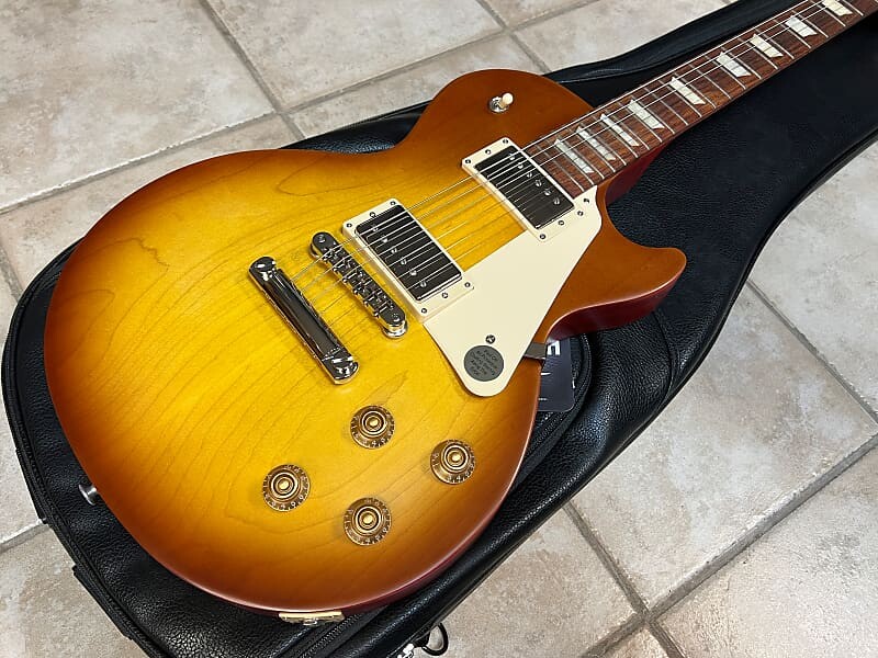 

Электрогитара Gibson Les Paul Tribute 2022 г. Сатин Чай со льдом Les Paul Tribute Electric Guitar Satin Iced Tea