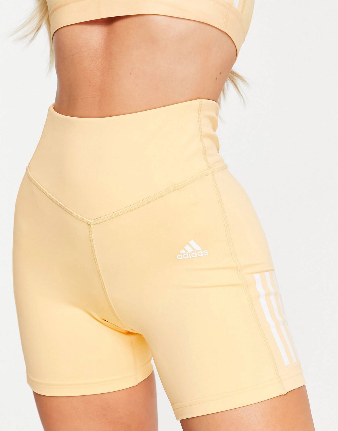 

Оранжевые короткие леггинсы с 3 полосками adidas Training Hyperglam