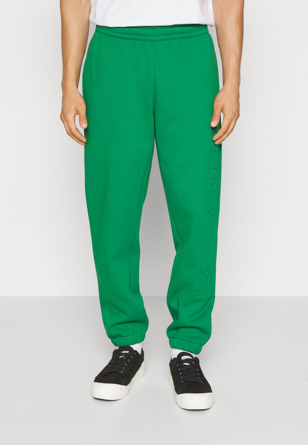 цена Спортивные брюки Lacoste, зеленые