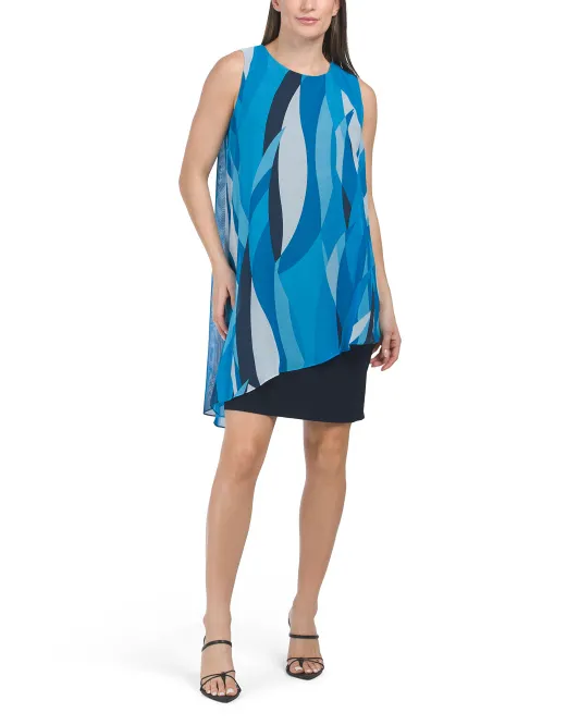 

Мини-платье без рукавов с абстрактным принтом и каскадной накладкой Slny, темно-синий