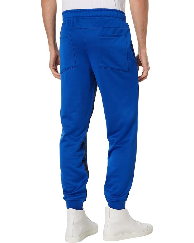 

Брюки PUMA Rhuigi Track Pants, цвет Surf the Web