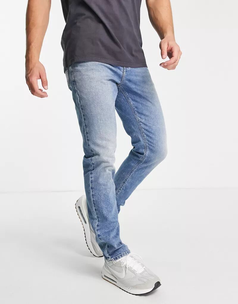 Винтажные синие эластичные джинсы средней степени стирки ASOS