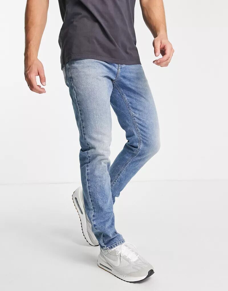 

Винтажные синие эластичные джинсы средней степени стирки ASOS