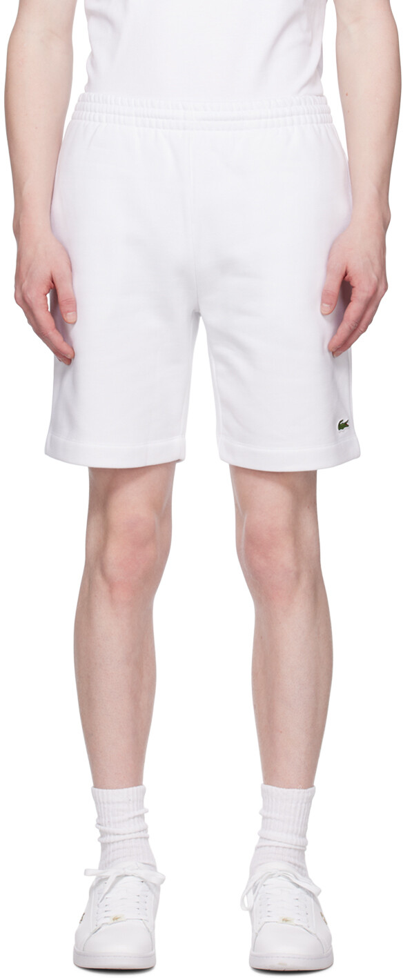 

Белые шорты с нашивками Lacoste