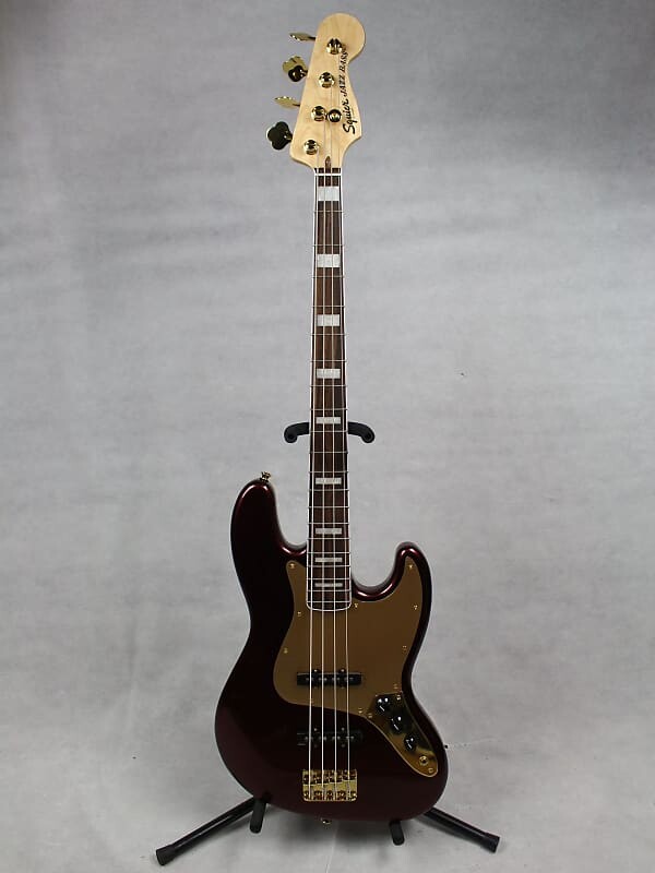 

Squier 40th Anniversary Jazz Bass Gold Edition Ruby Red Metallic Fender 0379440515