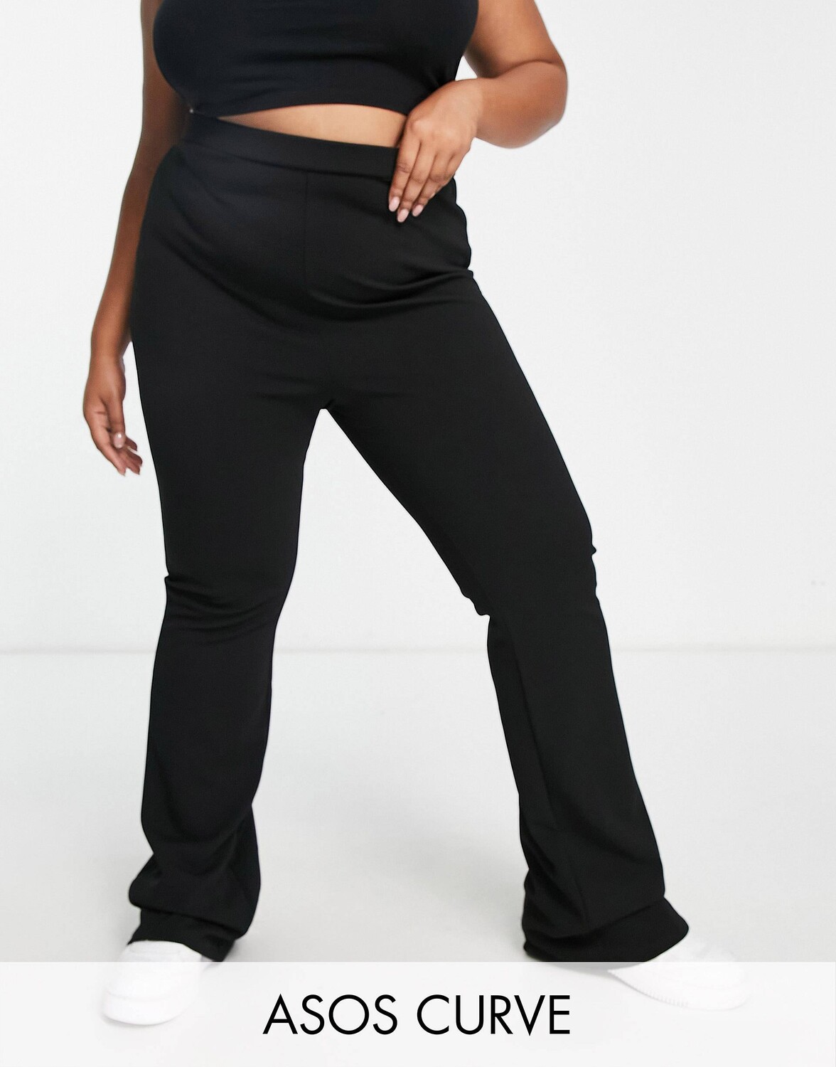 

Черные расклешенные брюки из джерси ASOS DESIGN Curve