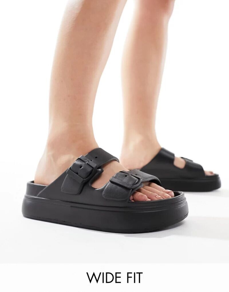 

Черные сандалии на плоской платформе с двумя пряжками ASOS Wide Fit Freestyle